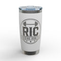 A white insulated tumbler with a clear lid and brushed stainless steel accents, featuring a dark gray circular 'RIC RAISING IRON CO' logo on the front.